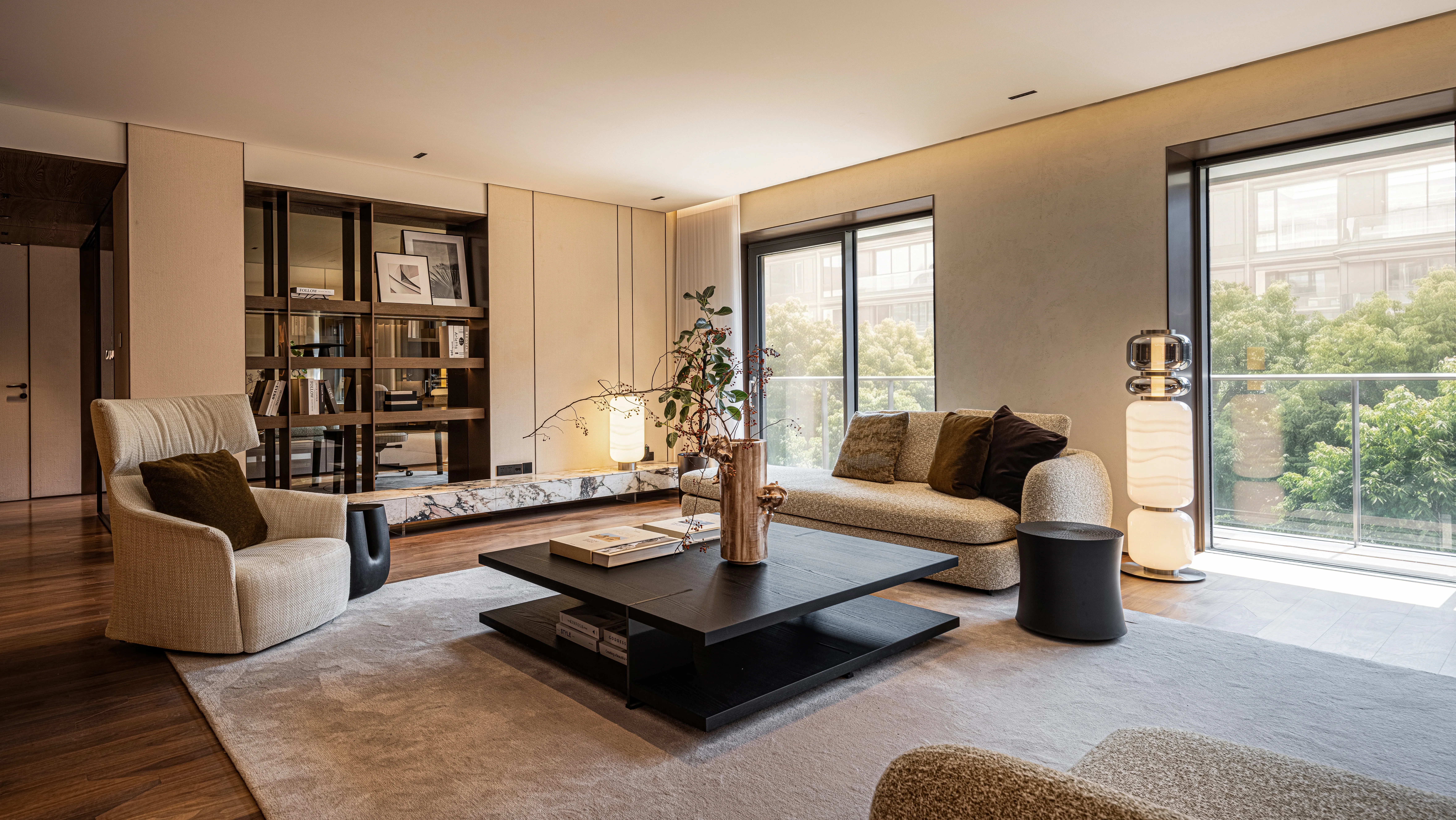 Living room with beige sofa, dark coffee table and balcony view, The Amber Residence, Beijing