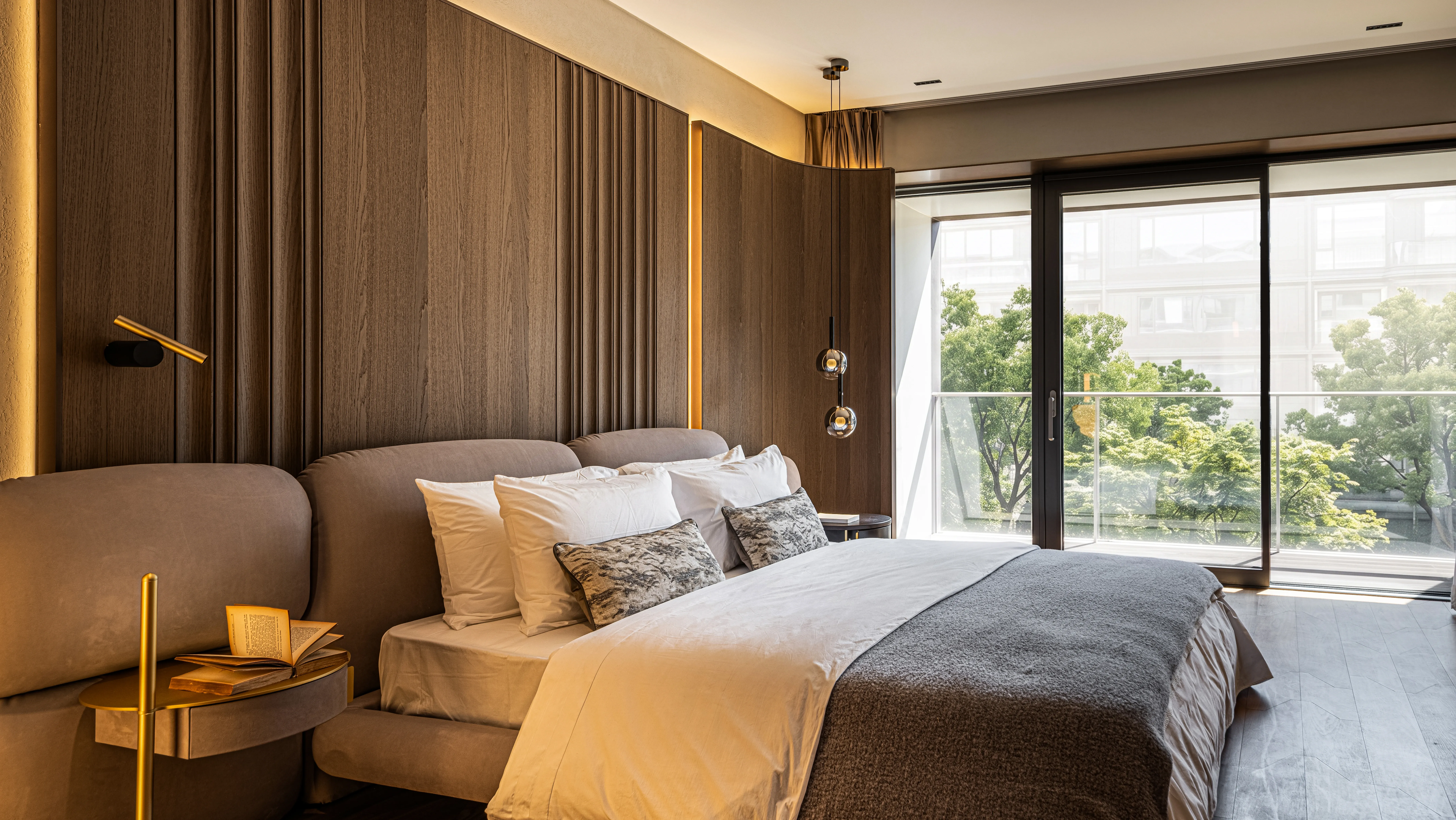 Bedroom with ribbed wood wall, upholstered bed and balcony view, The Amber Residence, Beijing
