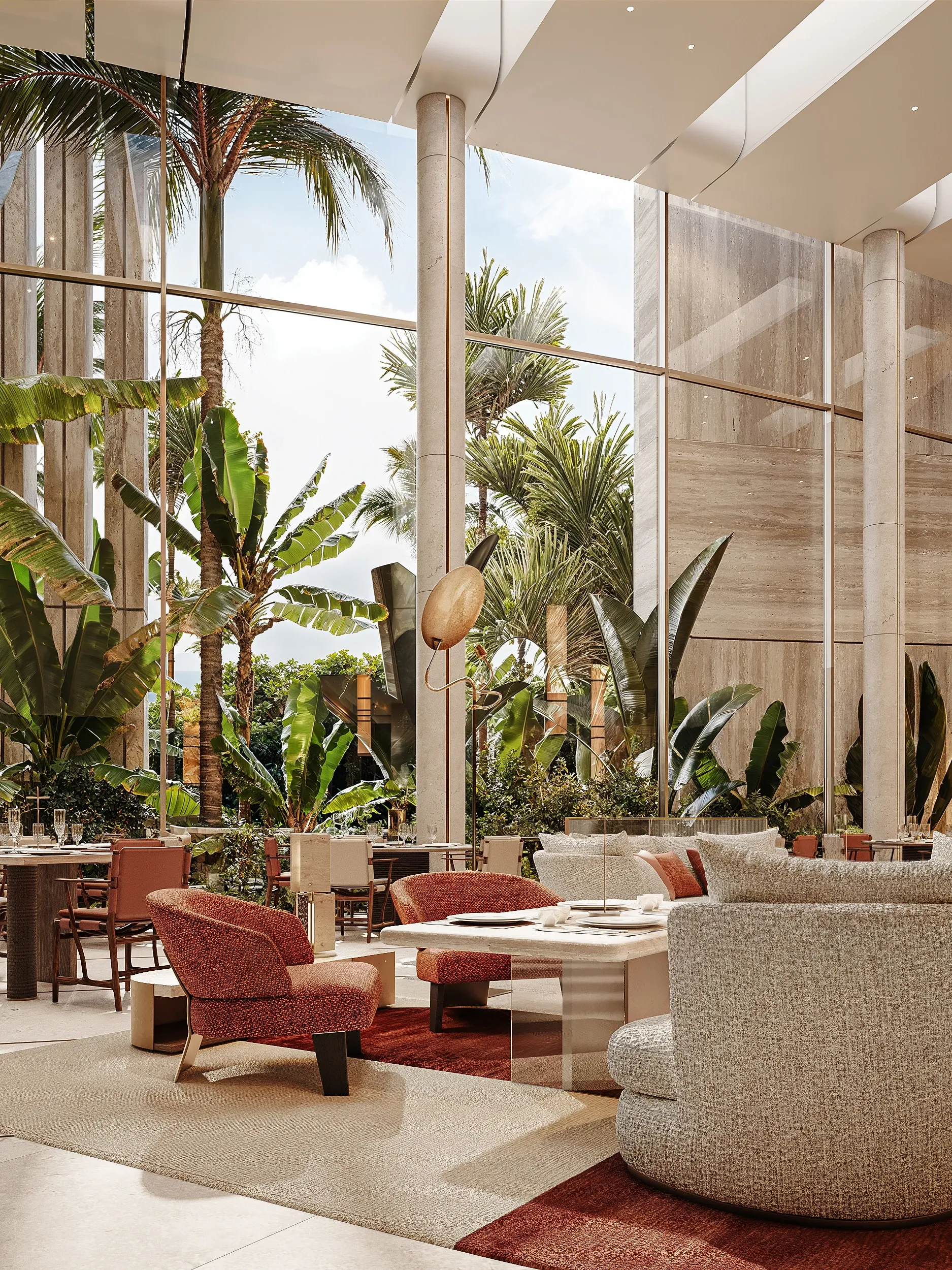 Double-height lounge with terracotta armchairs and lush indoor palms, Masaya Restaurant, The Ritz-Carlton Bahrain