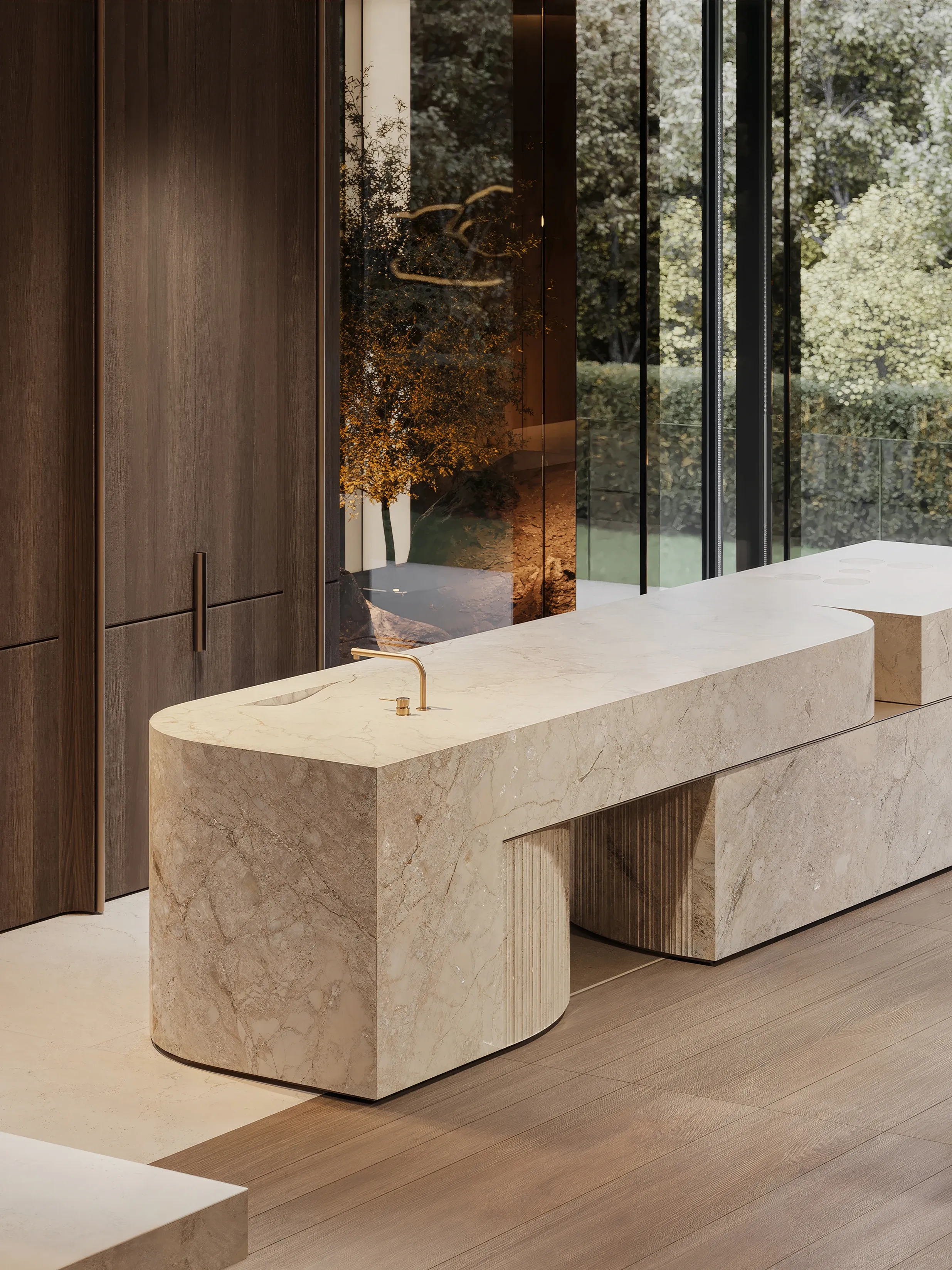 Curved monolithic stone kitchen island with brass faucet, The Monolith Penthouse, Warsaw