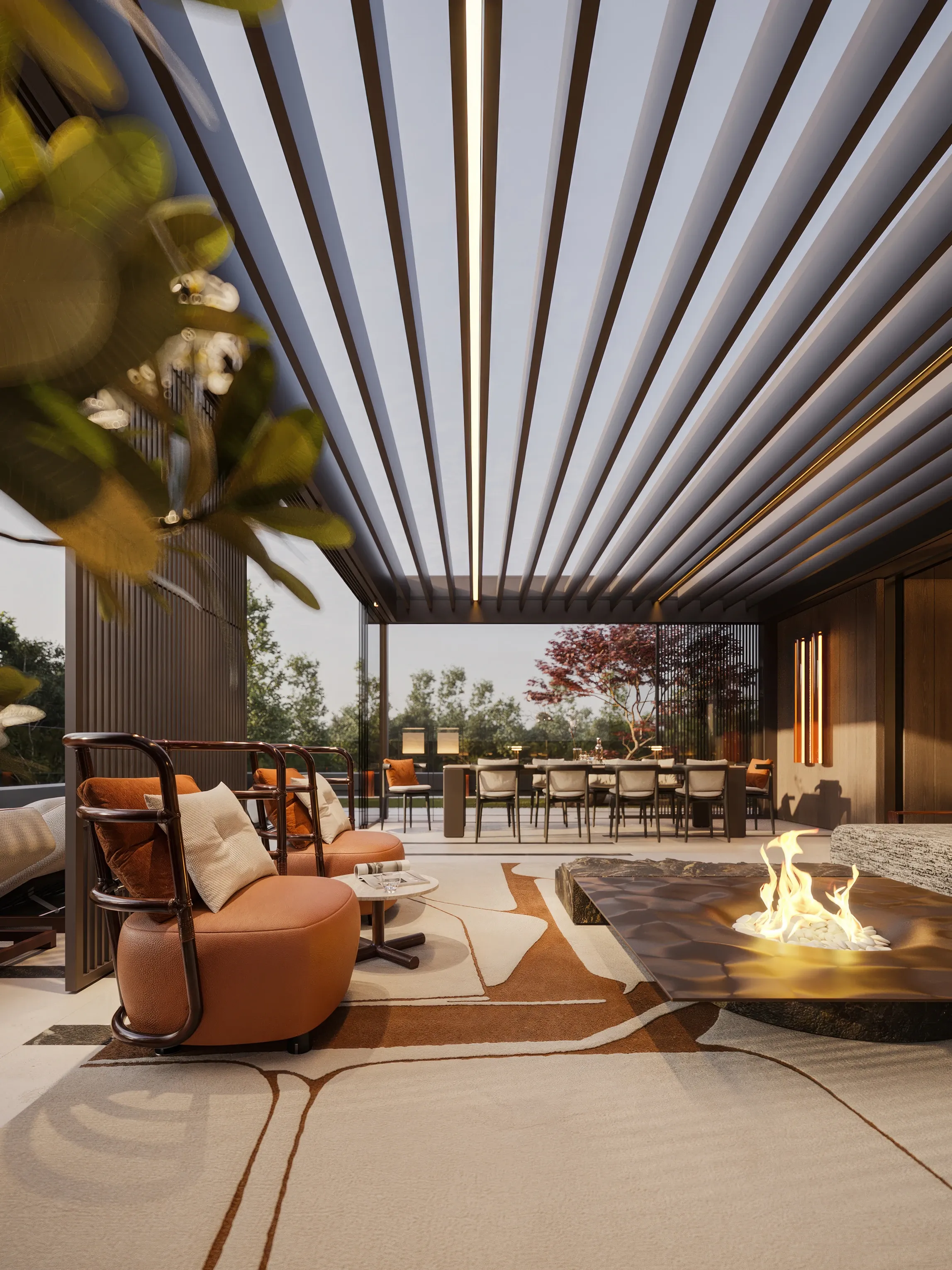 Terrace lounge seating beside fire pit with foliage foreground, The Monolith Penthouse, Warsaw