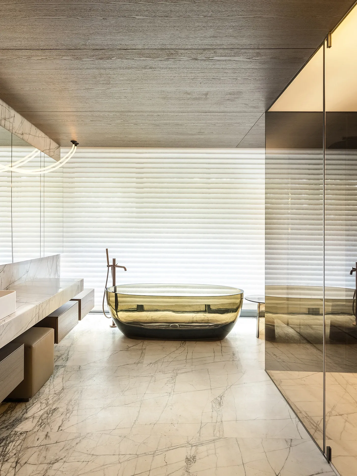 Marble bathroom with amber freestanding tub and wood ceiling, The Amber Residence, Beijing