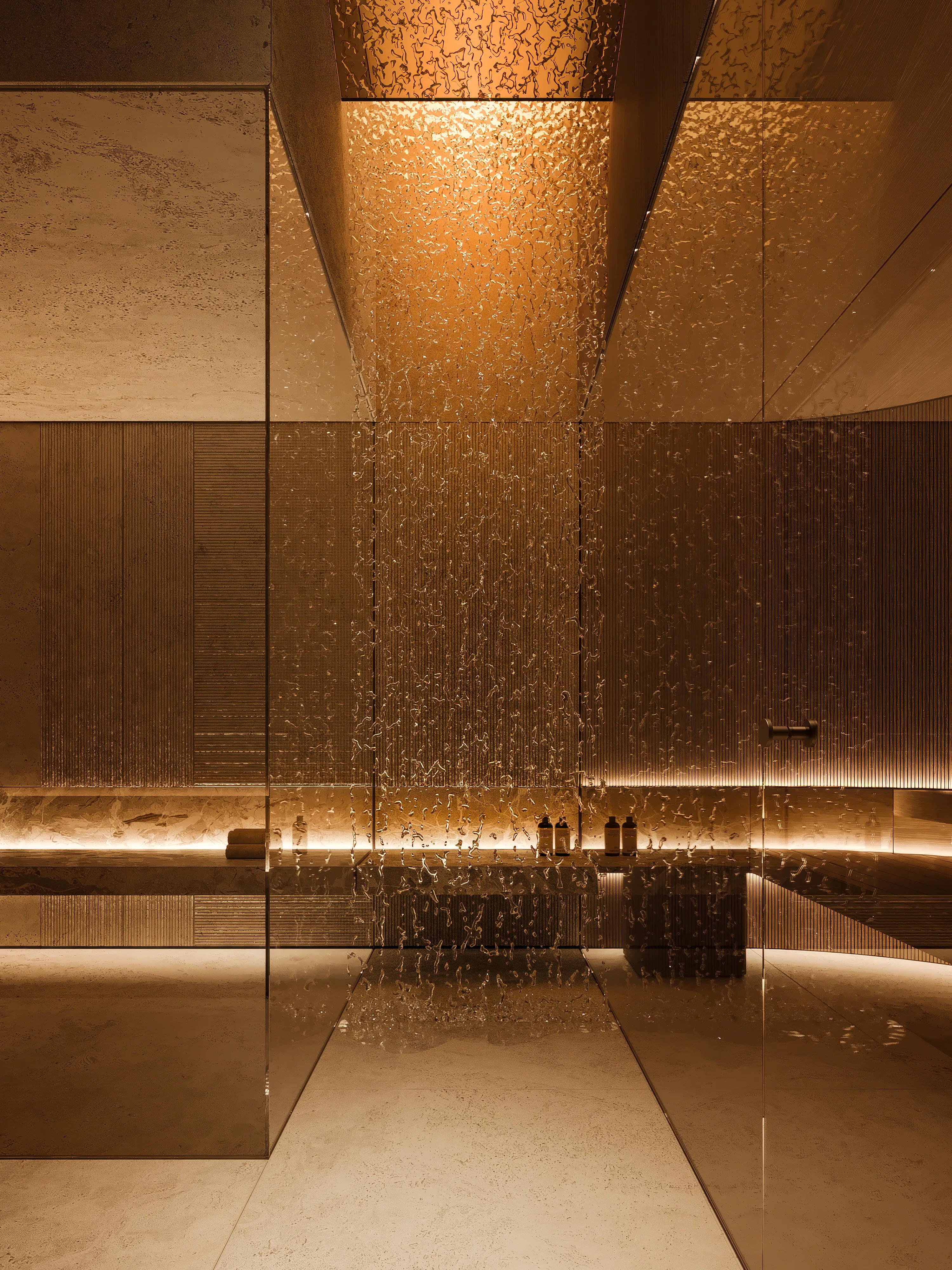 Spa rain shower with textured bronze ceiling and stone walls, The Lagoon Residents' Club, Dubai
