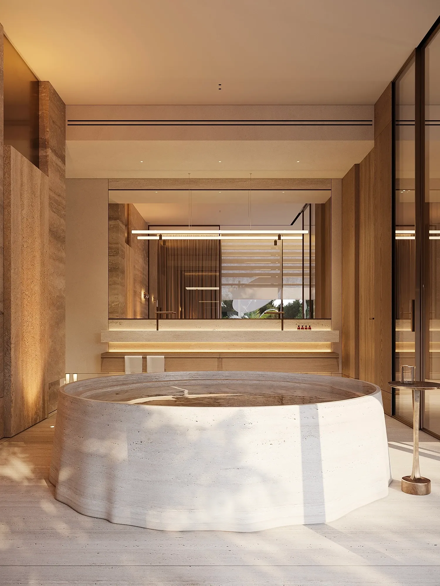 Sculptural stone bathtub beneath travertine walls and linear pendants, The Crown Villa Regnum Carya, Antalya